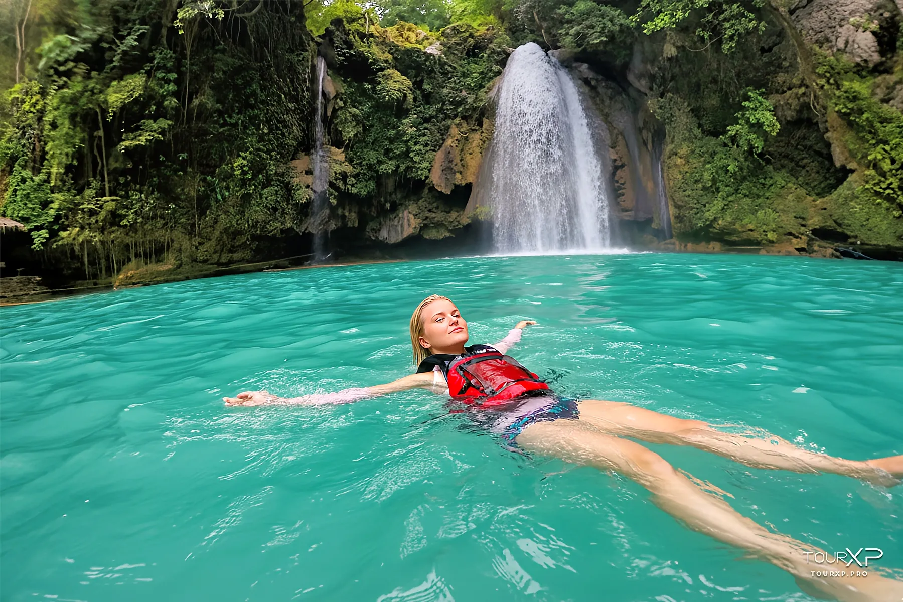Badian Falls Canyoneering from Dumaguete operated by TourXP Turquoise waterfalls of Kawasan Falls Badian Cebu