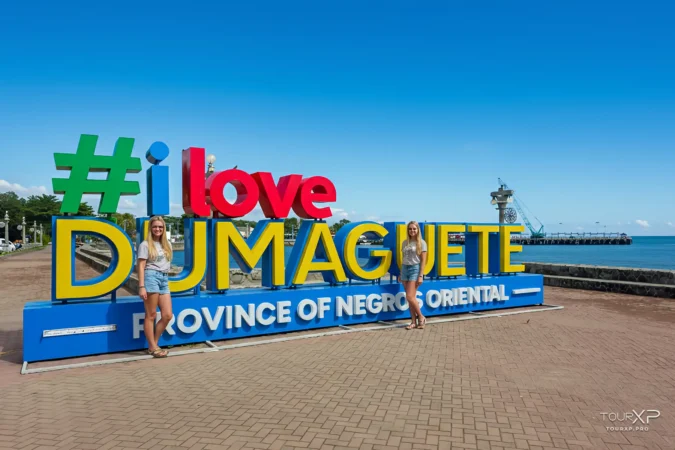 guests at I love Dumaguete Sign